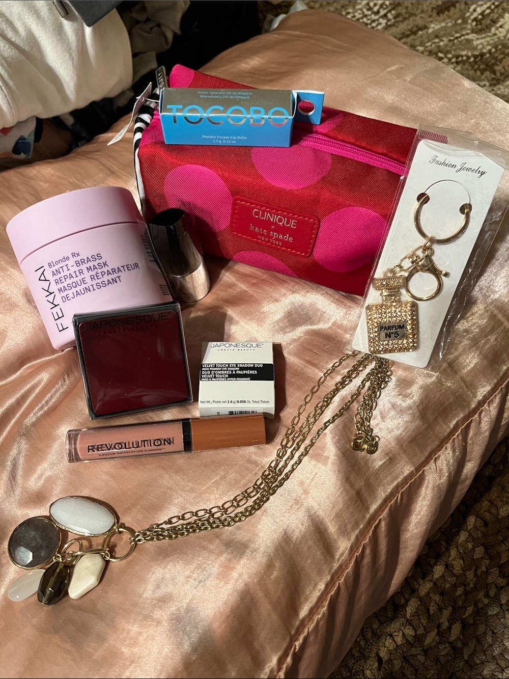 NWT Clinique Pink and Hot Pink Polka Dot Cosmetic Pouch with assorted goodies